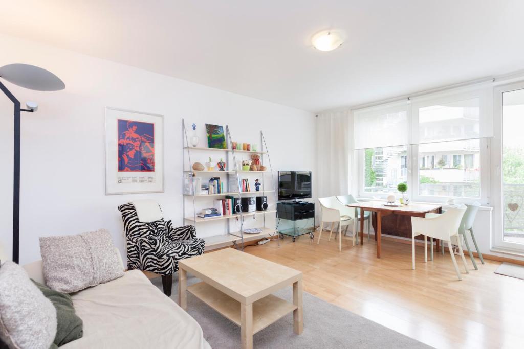 a living room with a couch and a table at Central Hackescher Markt in Berlin