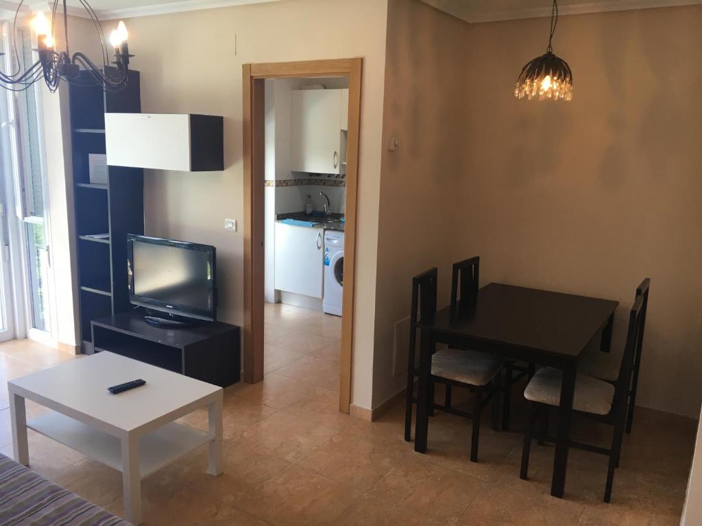A television and/or entertainment centre at Hotel Azcona