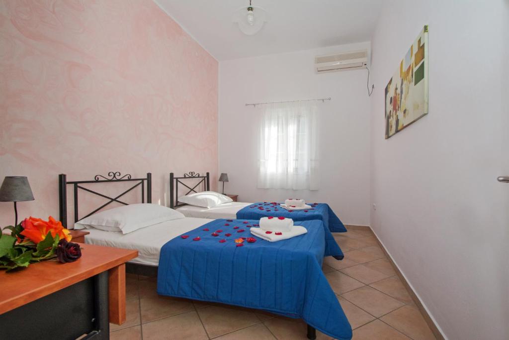 Postel nebo postele na pokoji v ubytování Pantonia Apartments