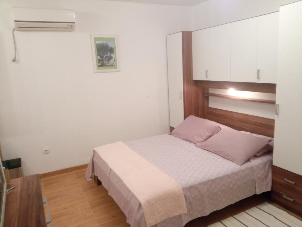 Posteľ alebo postele v izbe v ubytovaní Apartmani Lomar