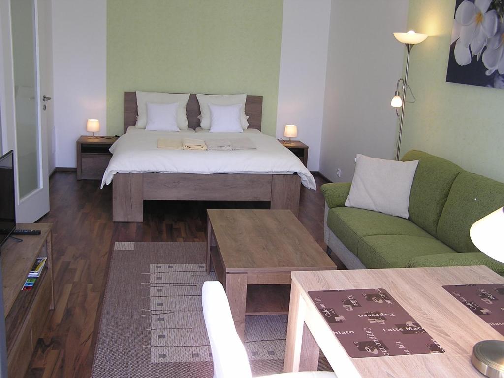 Postel nebo postele na pokoji v ubytování Gonda Apartments