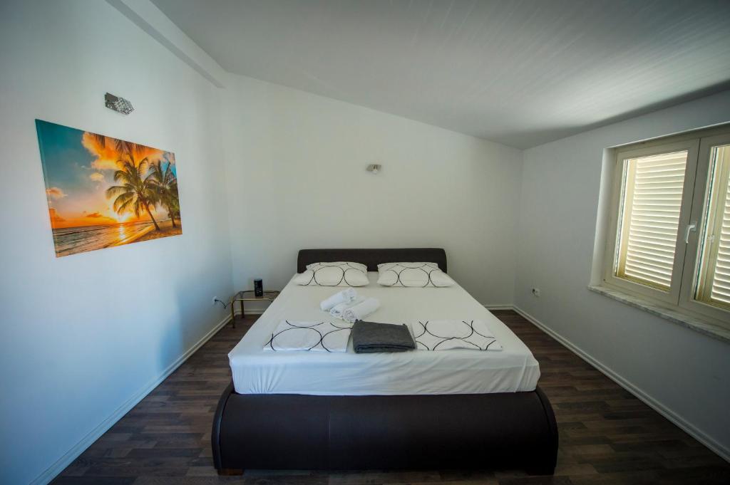 Ένα ή περισσότερα κρεβάτια σε δωμάτιο στο Apartments Nena