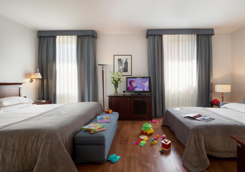 Postel nebo postele na pokoji v ubytování Starhotels Excelsior