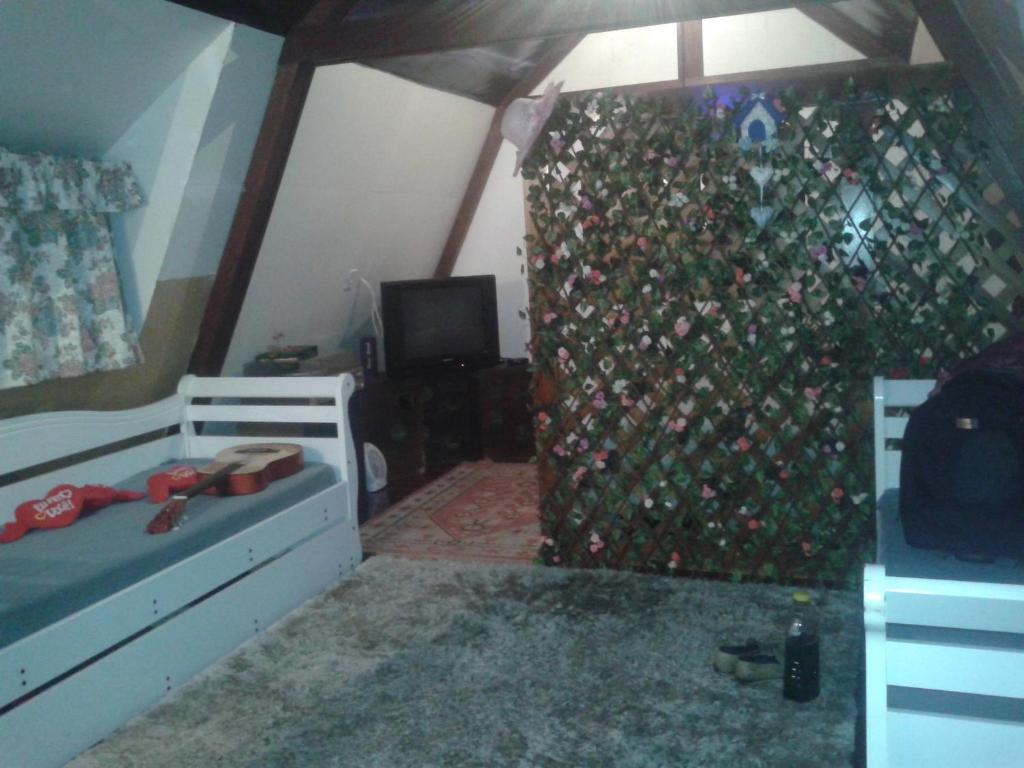 Et opholdsområde på Casa na Floresta em Campos do Jordao