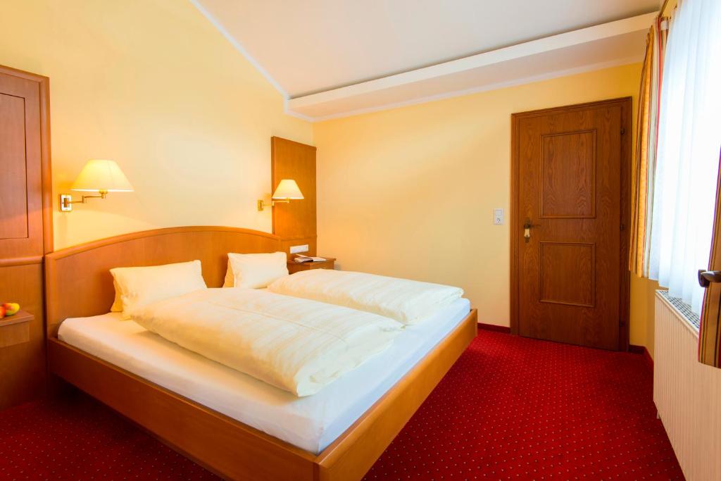 Postel nebo postele na pokoji v ubytování Appartements Monuth