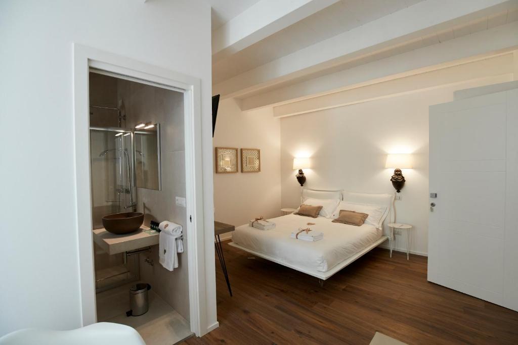 Postelja oz. postelje v sobi nastanitve Iulius Suite & Spa