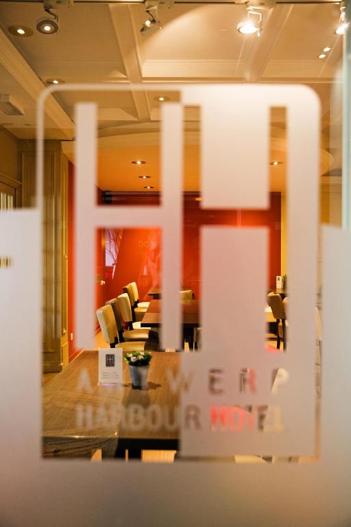 a view of a room with a table and chairs at Antwerp Harbour Hotel in Antwerp