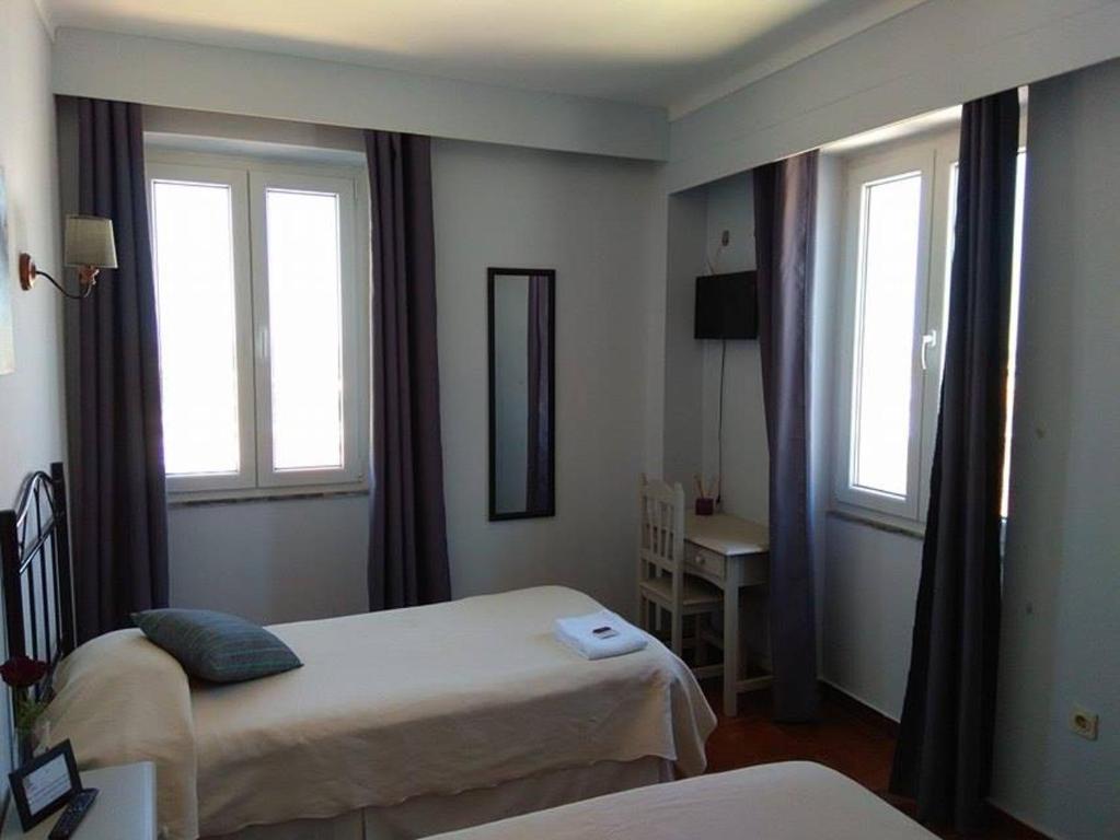 Casa Maria Victoria tesisinde bir odada yatak veya yataklar