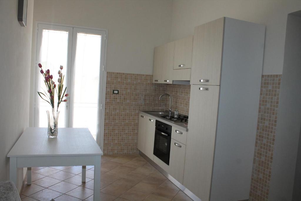 Kuchyňa alebo kuchynka v ubytovaní Casa Sole e Vento