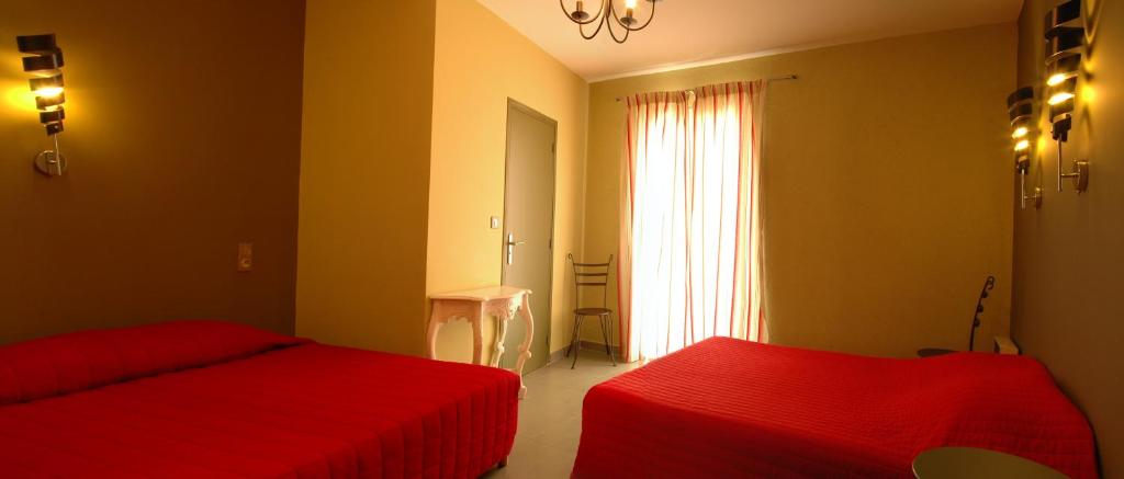 Postel nebo postele na pokoji v ubytování Hôtel la Palma