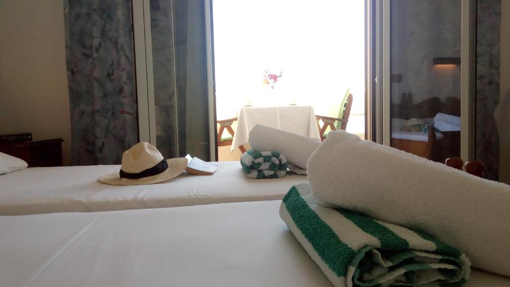 Letto o letti in una camera di Hotel Theris
