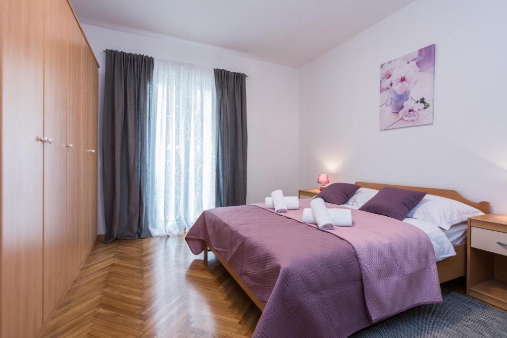 Ліжко або ліжка в номері Melita Center Apartment