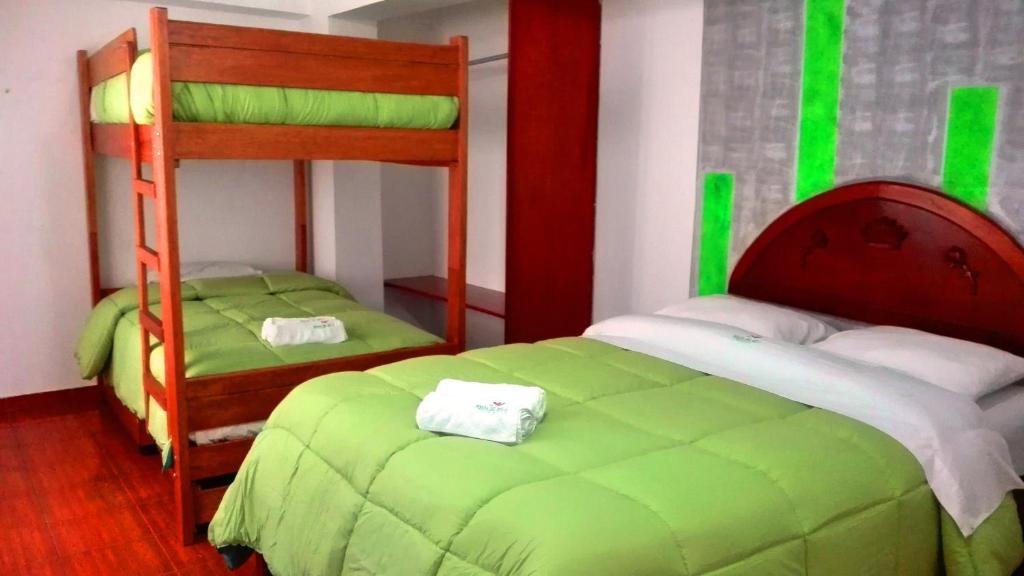 Postel nebo postele na pokoji v ubytování La Posada del Rey - Lima Airport Hostel