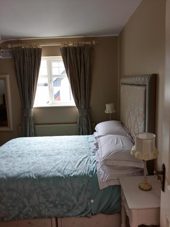 Postel nebo postele na pokoji v ubytování Lír B&B