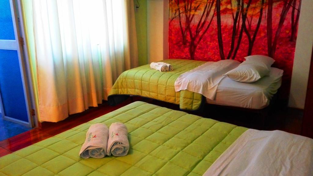 Postel nebo postele na pokoji v ubytování La Posada del Rey - Lima Airport Hostel