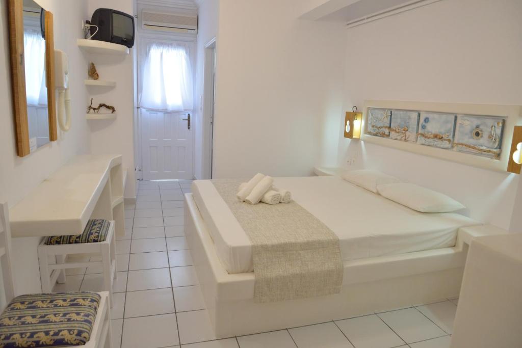 Postel nebo postele na pokoji v ubytování Hotel Apartments Giannis