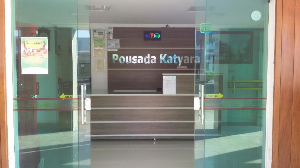 a view through a glass door of a stair case at Pousada katyara in Amargosa