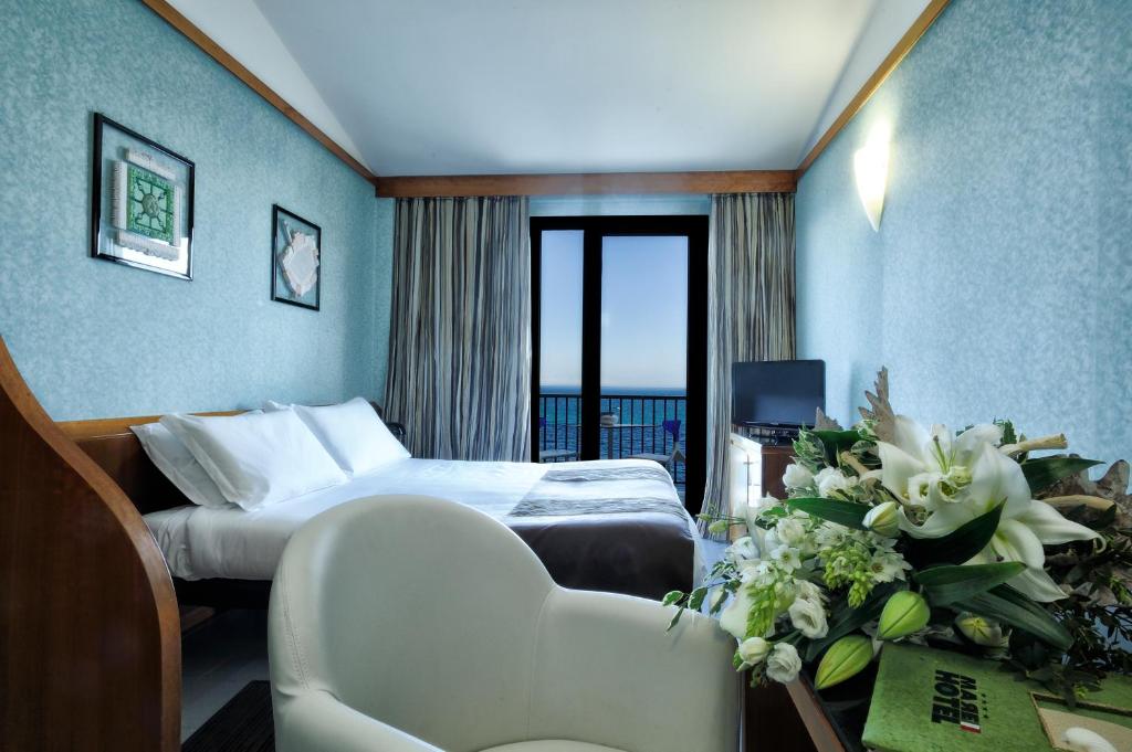Llit o llits en una habitació de Mare Hotel