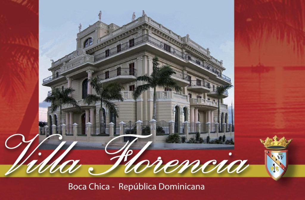 un poster di un grande edificio bianco con palme di Villa Florencia a Boca Chica