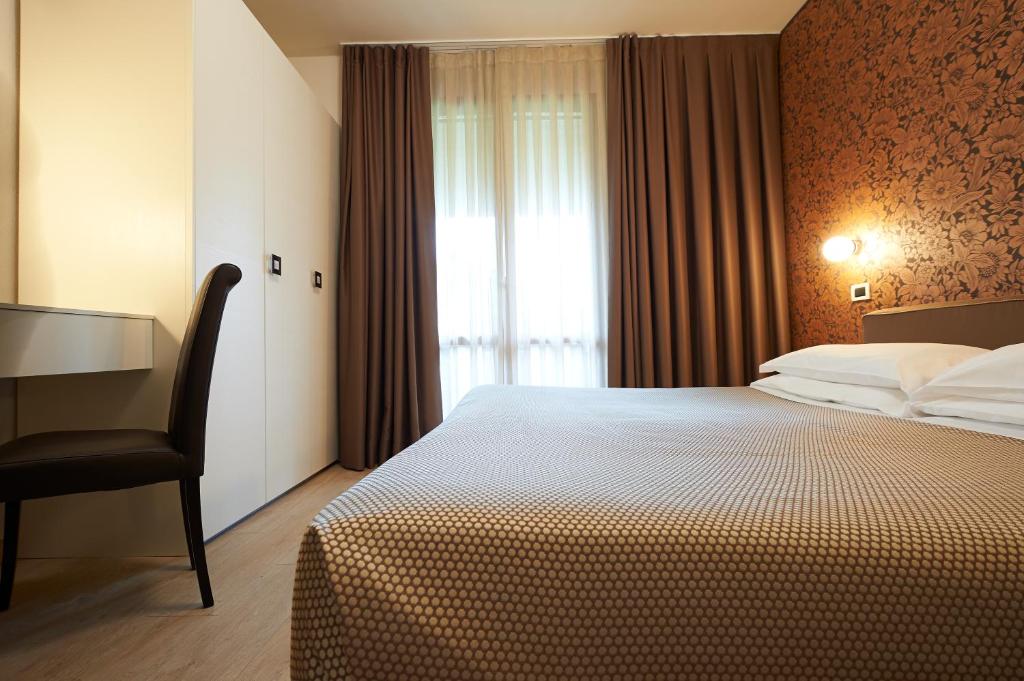 Postel nebo postele na pokoji v ubytování Park Hotel Chianti