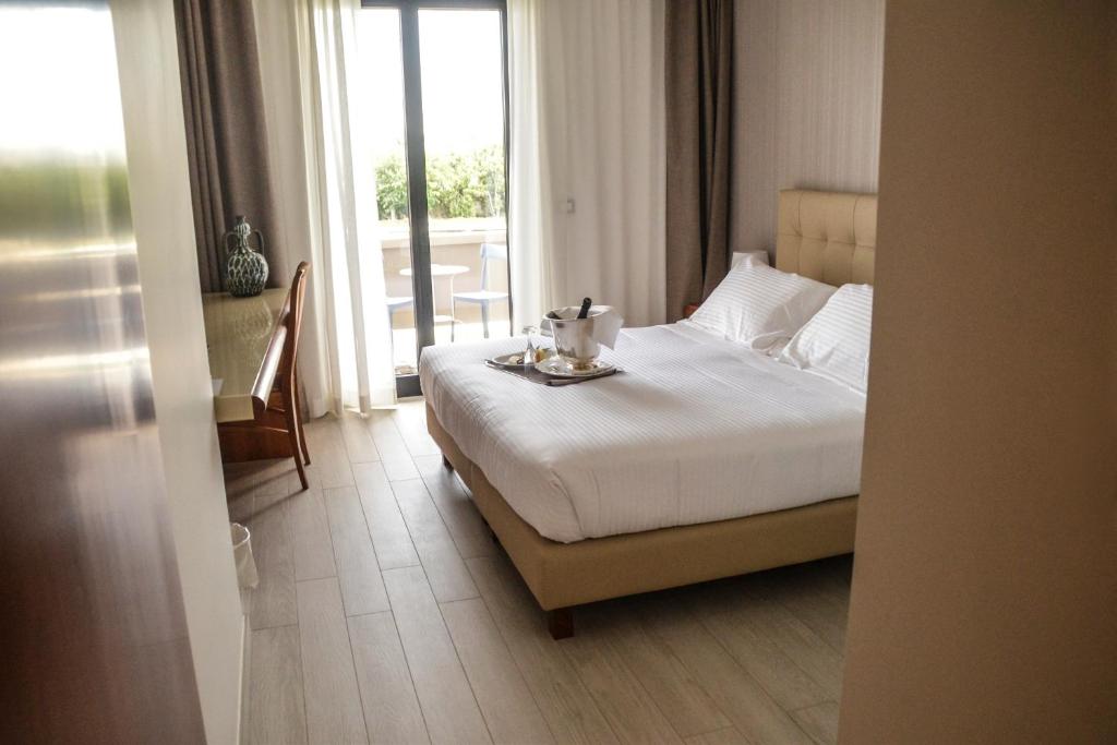 Postel nebo postele na pokoji v ubytování D'Aragona Lifestyle Hotel