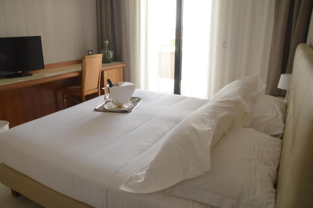 Postel nebo postele na pokoji v ubytování D'Aragona Lifestyle Hotel