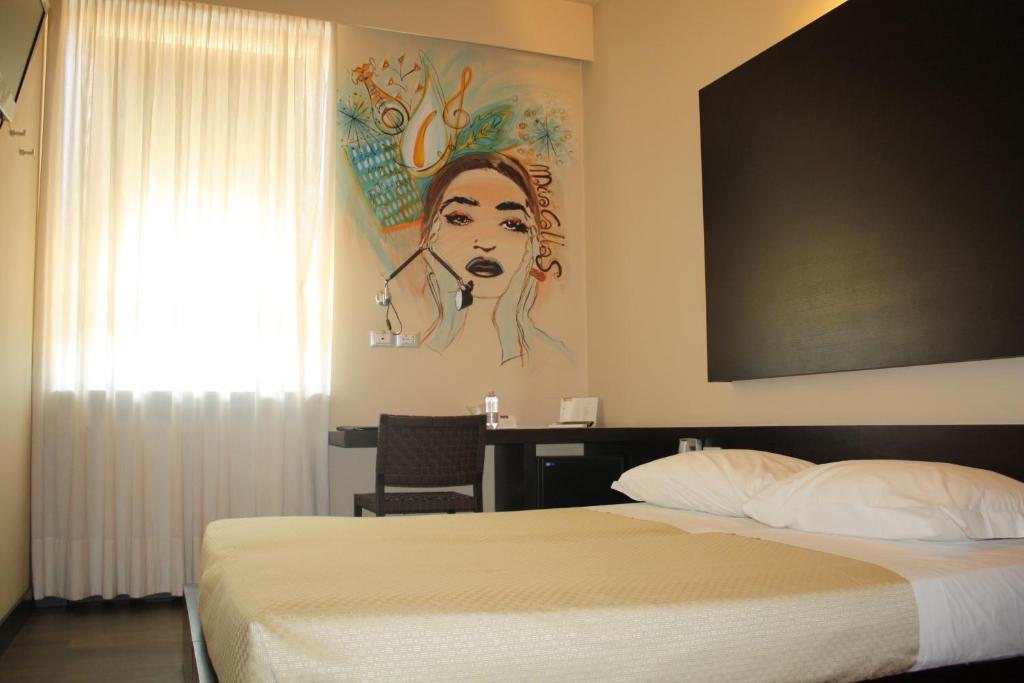 Postel nebo postele na pokoji v ubytování Art Hotel Udine