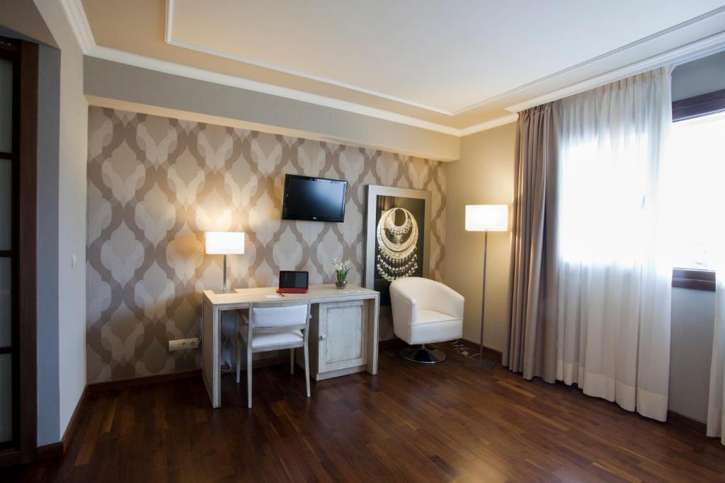 Posteľ alebo postele v izbe v ubytovaní Hotel Os Olivos