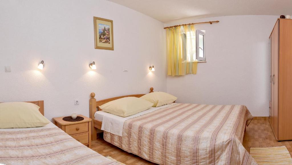 Posteľ alebo postele v izbe v ubytovaní Beach Resort Apartments Bucina