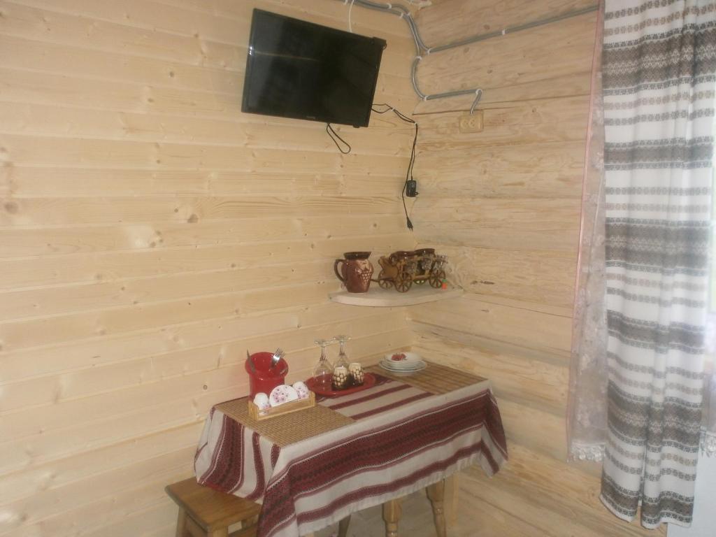 TV a/nebo společenská místnost v ubytování Cottage Лісовий