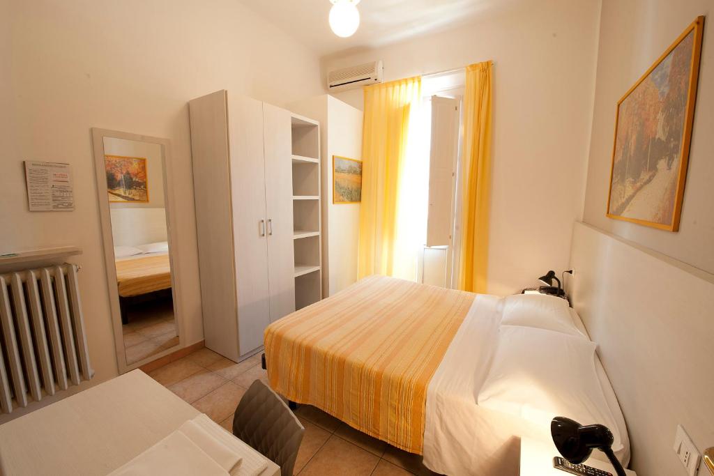 Postel nebo postele na pokoji v ubytování Hotel Gardenia