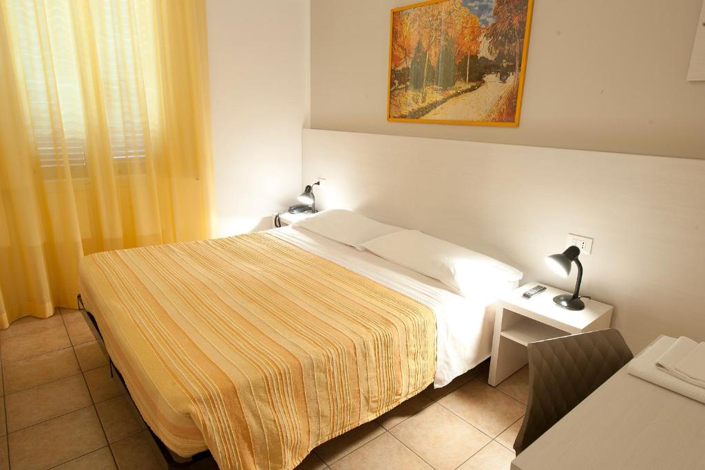 Postel nebo postele na pokoji v ubytování Hotel Gardenia