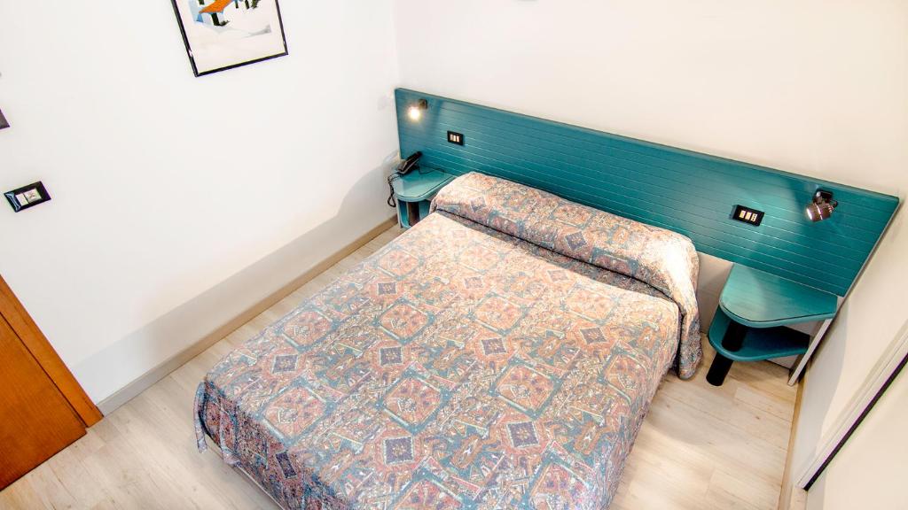 Postel nebo postele na pokoji v ubytování Hotel All'Orologio 3 Stelle Superior