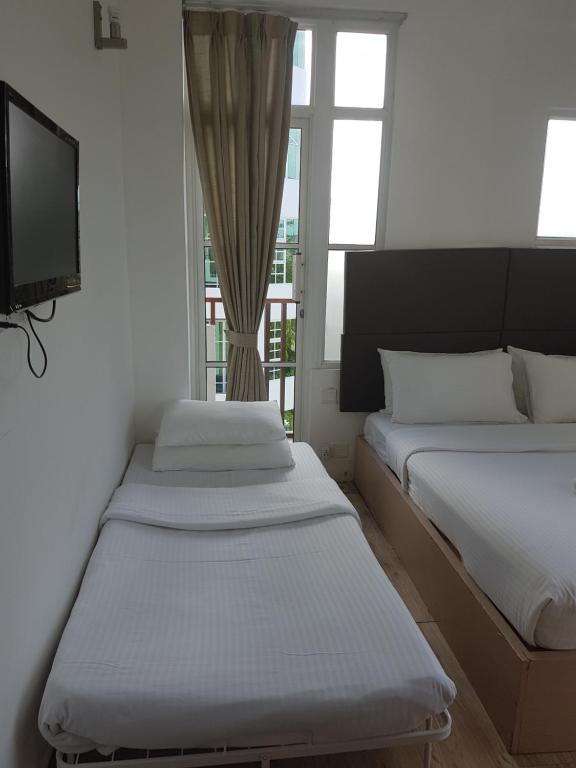 Postel nebo postele na pokoji v ubytování Express Inn at Hulhumale