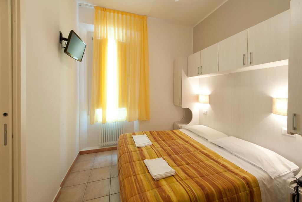 Postel nebo postele na pokoji v ubytování Hotel Gardenia