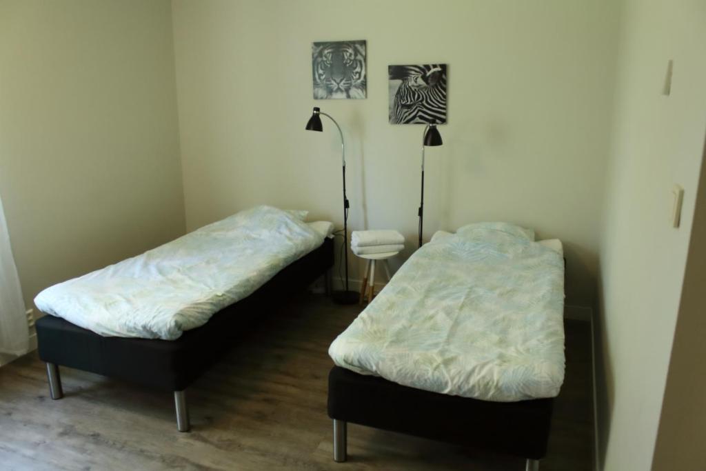 Postel nebo postele na pokoji v ubytování Ekbackens Vandrarhem