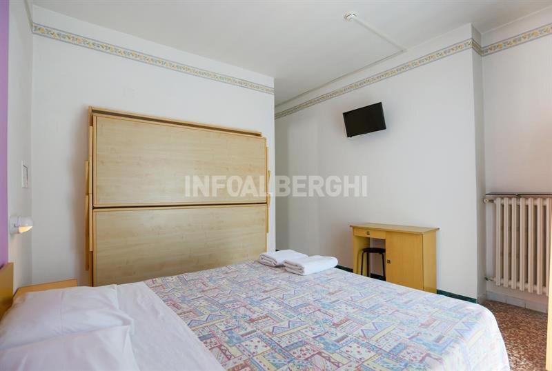 Postel nebo postele na pokoji v ubytování Atene Albergo Riccione