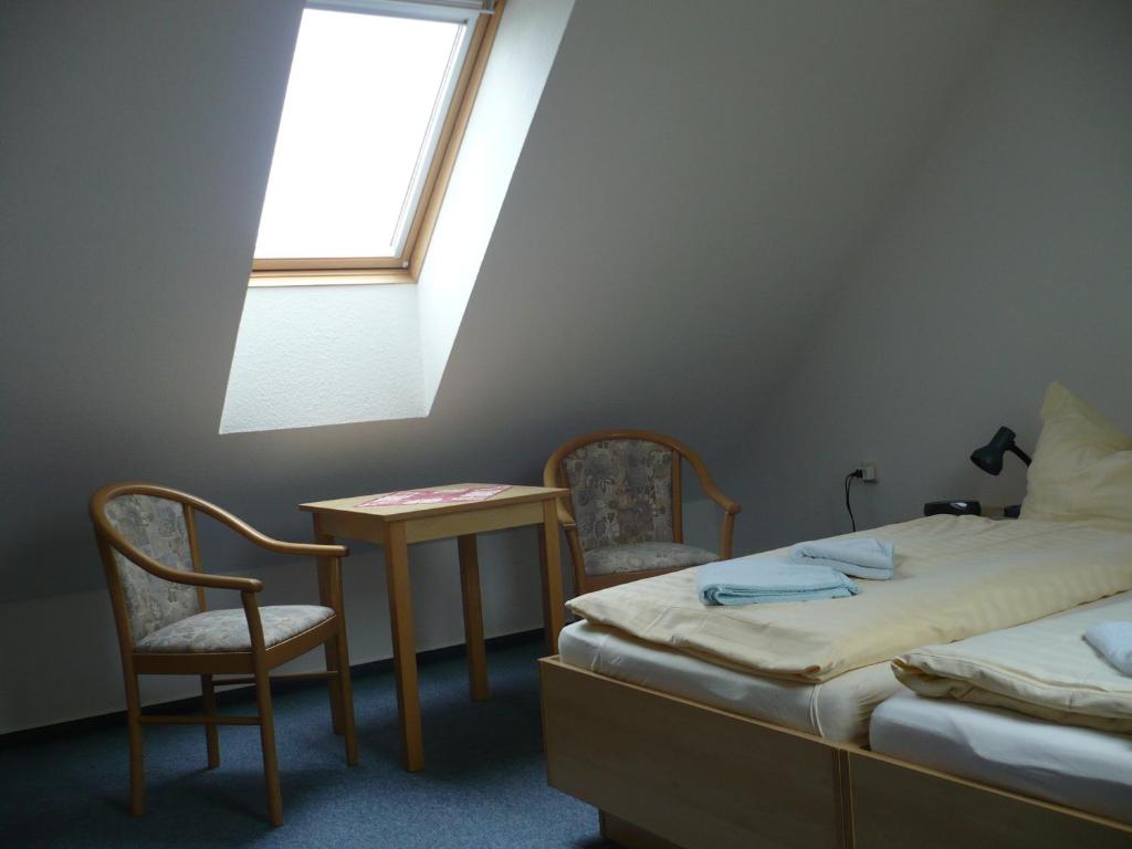 Postel nebo postele na pokoji v ubytování Hotel Pension Neptun