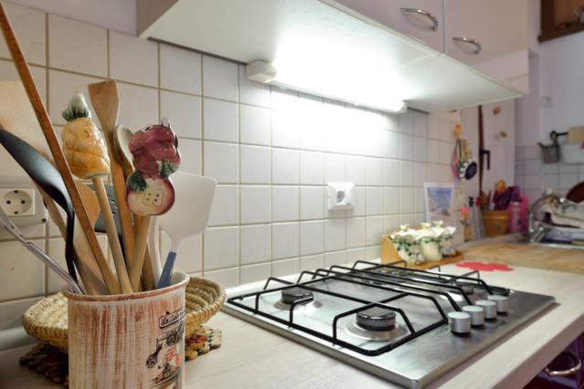 a kitchen counter with a stove top in a kitchen at Apartments Baredi in Izola