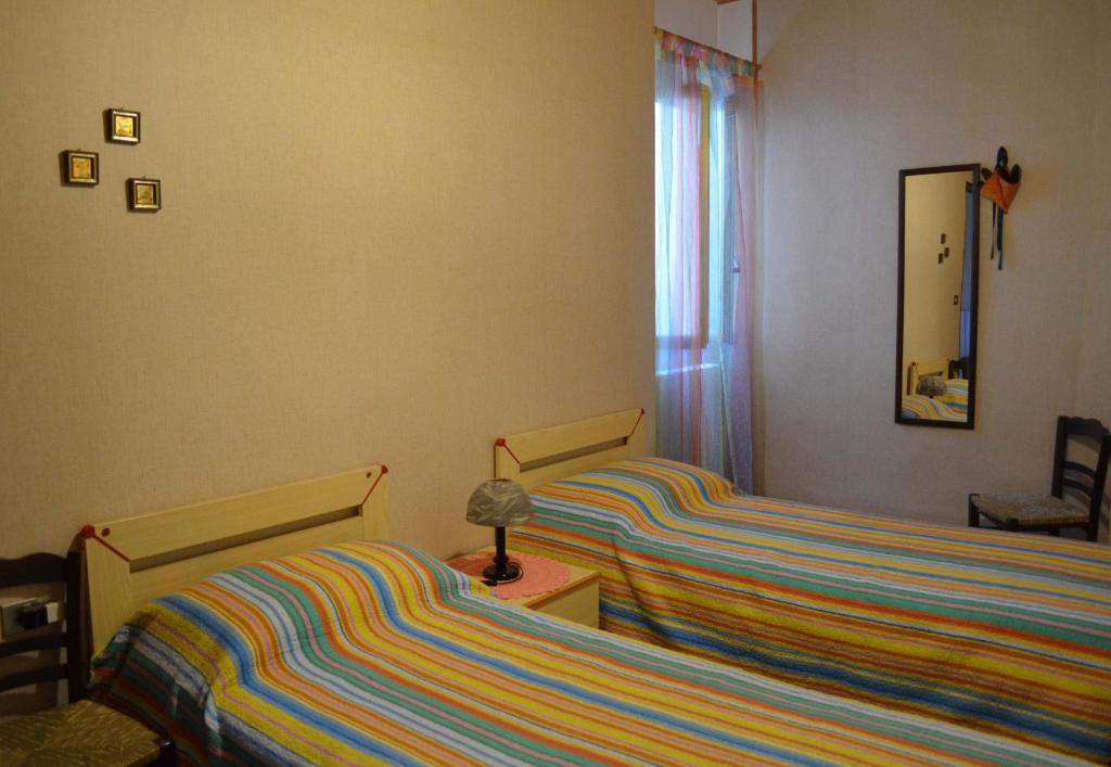 A bed or beds in a room at La Borgata