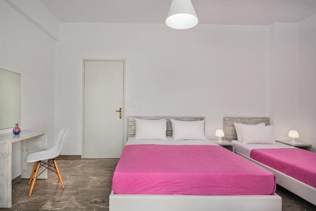 Łóżko lub łóżka w pokoju w obiekcie Villa Kavallaris & Apartments