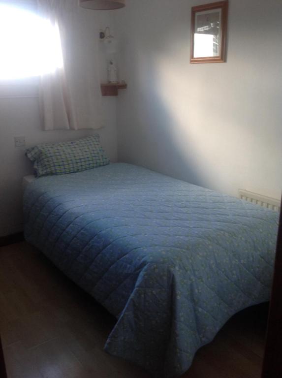 Postel nebo postele na pokoji v ubytování Divine Mercy B&B