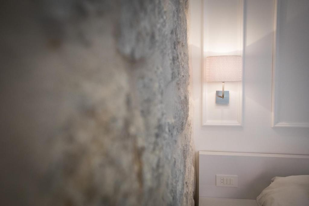 Postel nebo postele na pokoji v ubytování Casa Arancia