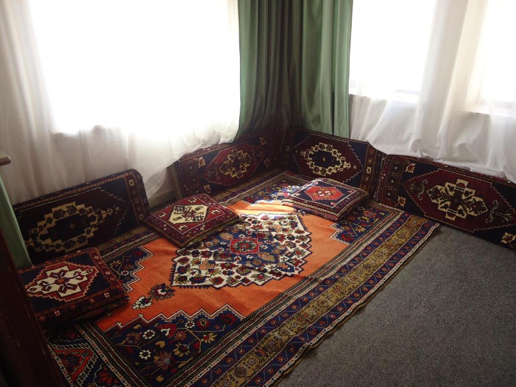 A bed or beds in a room at Akar Hotel