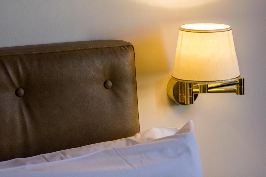A bed or beds in a room at Splendor Suite Rome - Suites & Apartments