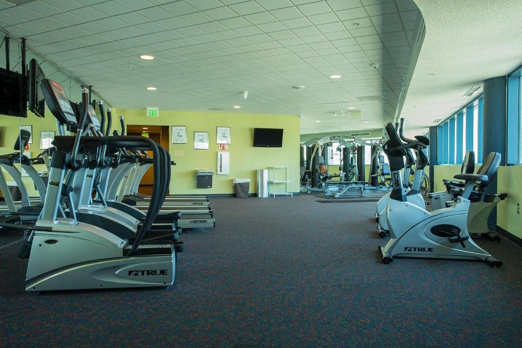 a gym with several treadmills and cardio machines at Avista Resort in Myrtle Beach