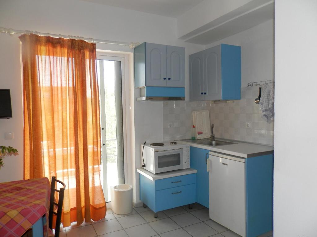 Kuchyň nebo kuchyňský kout v ubytování Silvi Mari Apartments
