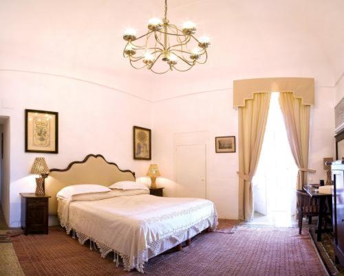 A bed or beds in a room at Masseria Torre Coccaro