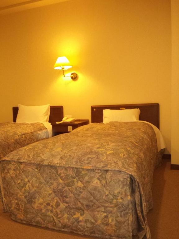 Postel nebo postele na pokoji v ubytování Mount View Hotel