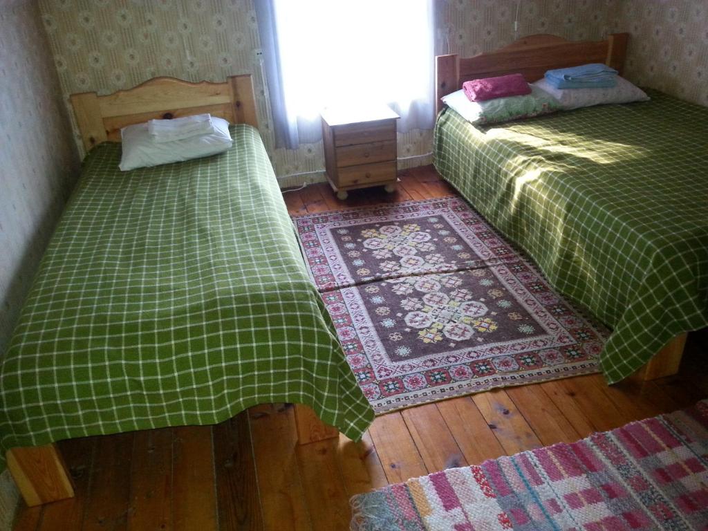 Postel nebo postele na pokoji v ubytování Kuus Tuba